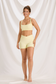 Full-length front view of the Yellow Curve workout set with a square-neck sports bra and matching shorts