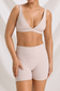 Front detail of the Bone High Waist Workout Set, showing the plunge neckline and matching shorts