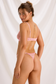 Back view of pink lace bra and thong with adjustable shoulder straps and a hook-and-eye bra closure