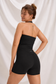 Back view of Moxy black halter workout set showing open-back top and high-waisted shorts