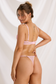 Back view of pink cherry blossom lingerie set showing adjustable bra straps, back clasp and matching thong