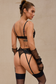 Model wearing elegant black lingerie with sequins