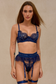 Navy blue lace lingerie set with satin details and studded embellishments