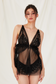 black sheer babydoll lingerie set with luminous pearl details

