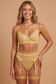 front view of yellow lace lingerie set with underwire bra, garter belt, thong, and leg garters