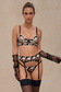 model standing in full three-piece black mesh lingerie set