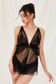 model wearing black see-through babydoll lingerie with pearl trim

